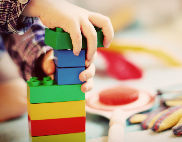 A child playing with building blocks.